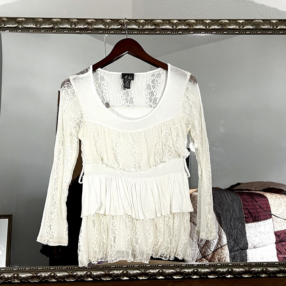 Very soft T-shirt. Feel lacy with belt loops very feminine very cute